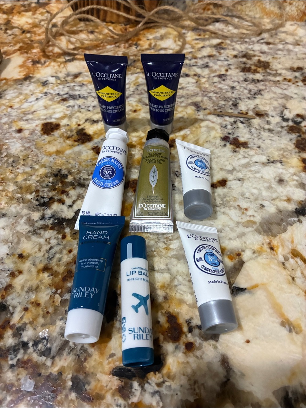 Loccitane travel kit never used 6 pieces plus Sunday Riley hand cream & lip balm